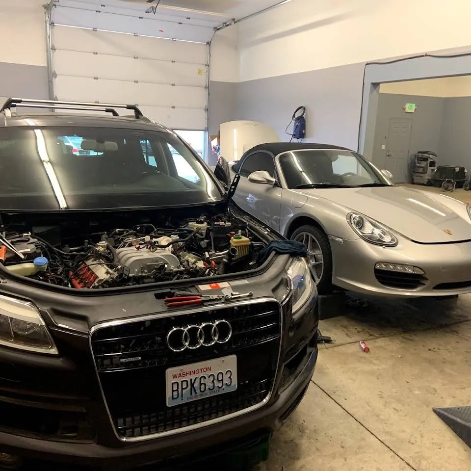 An Audi Q7 in our bay with its engine opened up